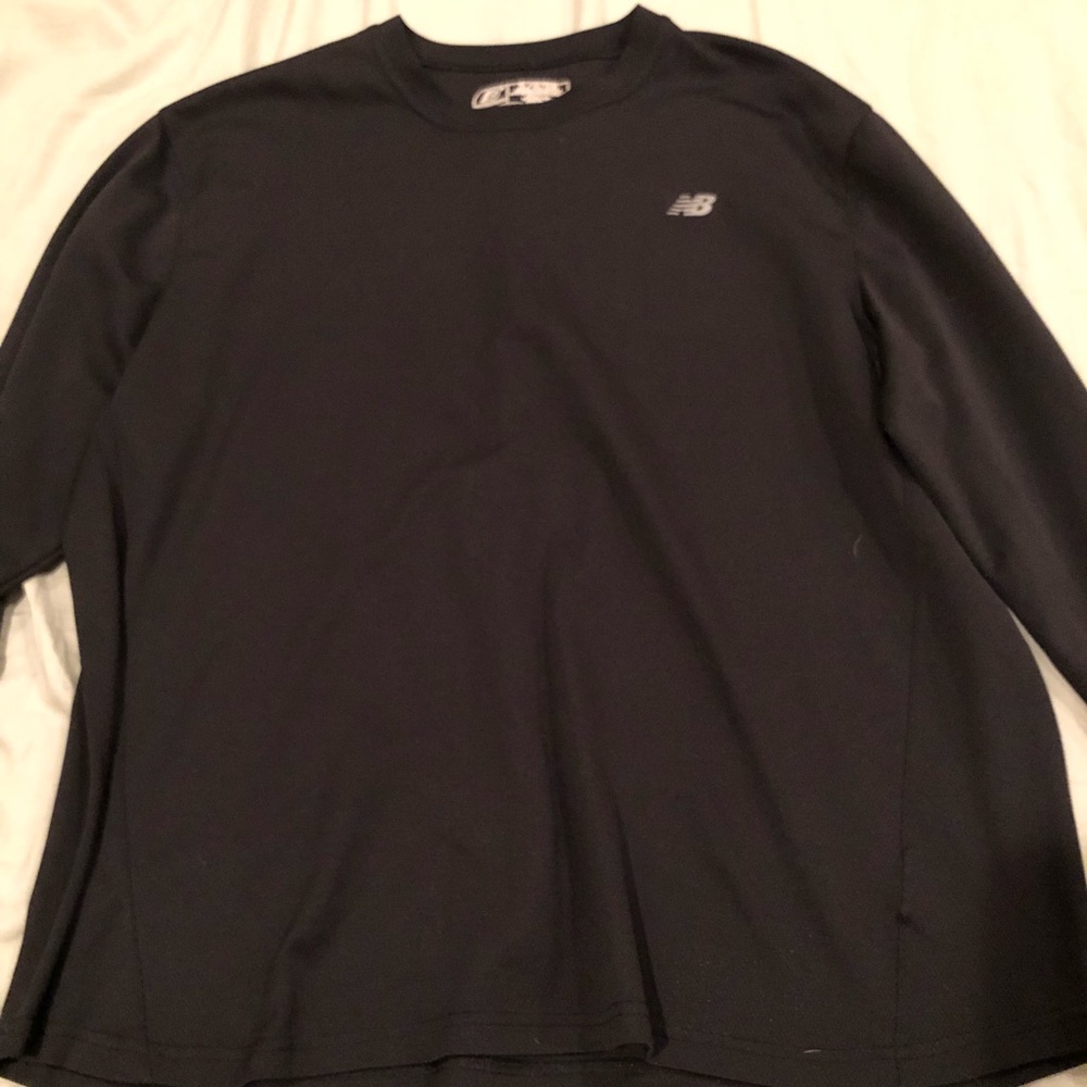Black Dri fit New Balance shirt.
